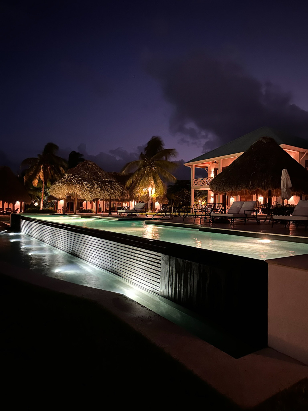 Night time view infinity pool