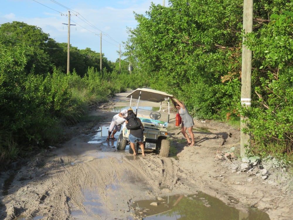 Golf cart sinking into mud