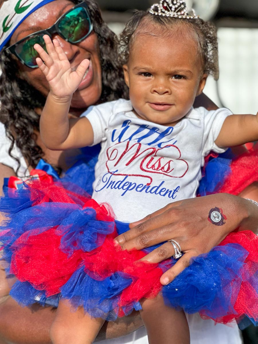 Baby in red white and blue Belize tutu