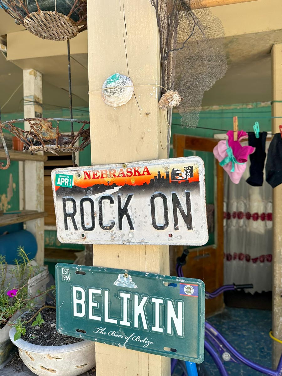 Rock On and Belikin license plates hanging on a home